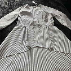 Gray/White high low blouse.Front button closure bow in the back.